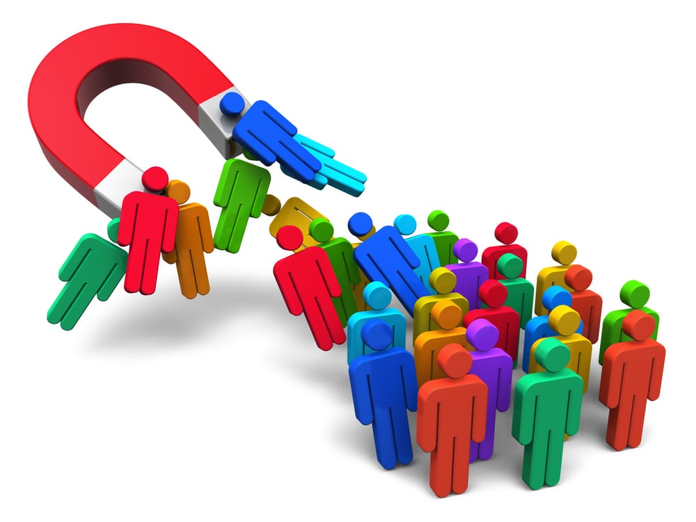 lead magnet ocial engineering concept: horseshoe magnet capturing crowd of color human figures isolated on white background