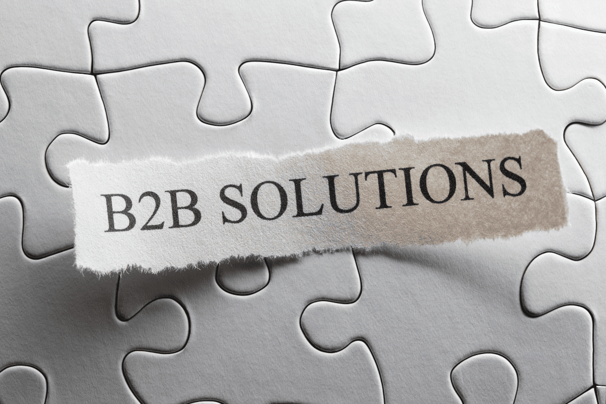 B2B solutions concept on puzzle background symbolizing the need for aligned sales and marketing strategies in rep-free buying experiences