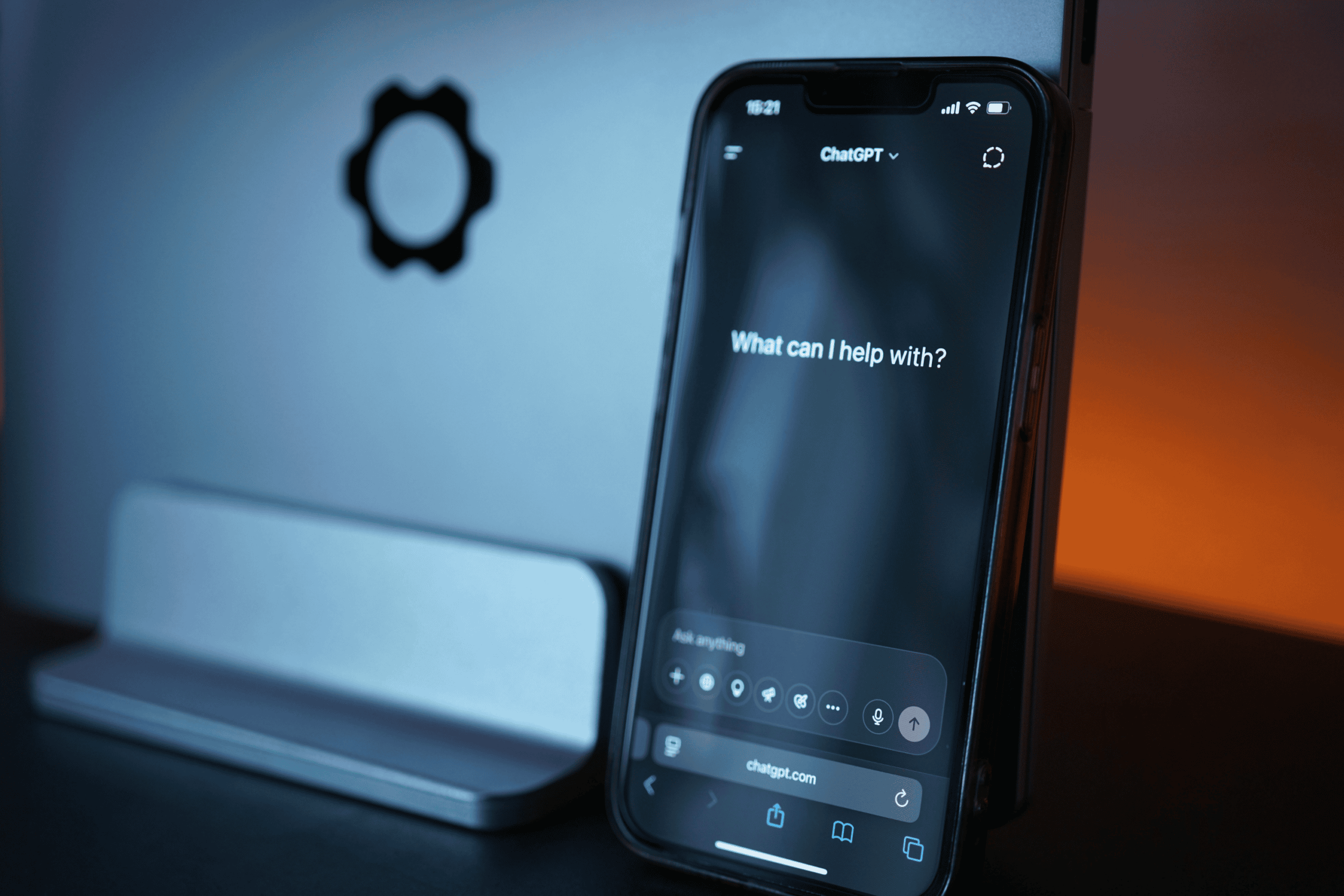 Why Your Brand Isn't Showing Up in ChatGPT or Google AI - smartphone with chatgpt app open, screen reads "What can I help with?
